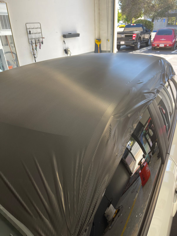 Car roof finished in carbon fiber textured vinyl wrap in Santa Maria, CA